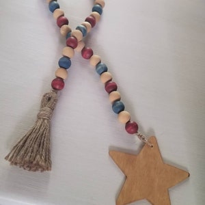 Patriotic wood bead garland. Rustic vintage red, tan, blue beads. Farmhouse bead garland