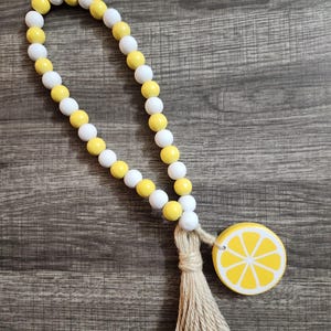 Lemon wood bead garland, lemon decor, wood bead garland, yellow and white beads with lemon slice accent.