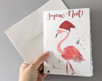 Christmas card, watercolor flamingo in santa hat, pink white watercolor flamingo merry christmas on white watercolor paper with worn borders