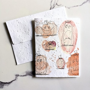 Lanterne citrouille sur papier de graines ou papier blanc aquarelle, carte d'halloween, carte d'automne
