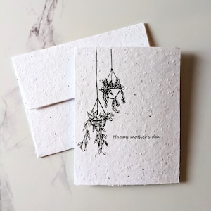 Tarjeta del día de la madre, plantas colgantes sobre papel de semilla o papel blanco de acuarela, feliz día de la madre