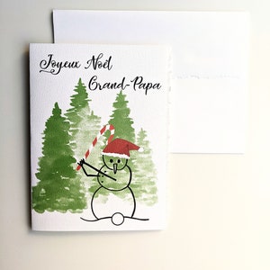 Weihnachtskarte, Aquarell Baum Schneemann Golf spielen auf dickem Aquarell aus weißem Papier, abgenutzte Ränder, Zuckerstange Weihnachtsmütze