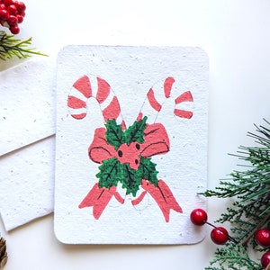 Sucre de Noël avec noeud sur papier à planter ou papier blanc aquarelle, bordures usées