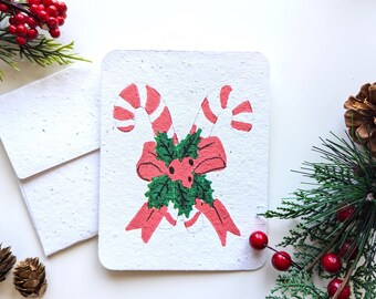 Christmas candy cane with bow on plantable paper or watercolor white paper, worn out borders