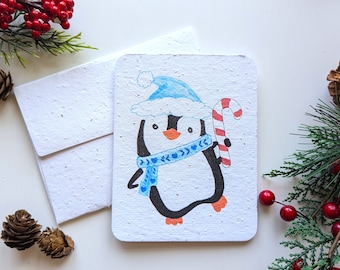 Christmas winter penguin with sugar cane on plantable paper or watercolor white paper, worn out borders