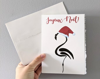 Christmas card, minimalist flamingo in santa hat, black marker drawing flamingo merry christmas on white watercolor paper with worn borders