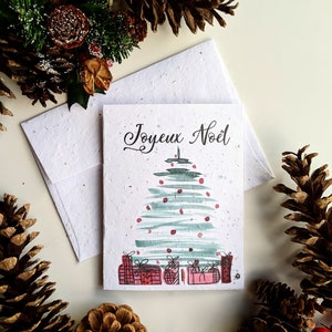 Enveloppe de carte de Noël à planter graines de fleurs sauvages, arbre de Noël avec cadeau sur papier de graines de fleurs sauvages blanc, joyeux Noël