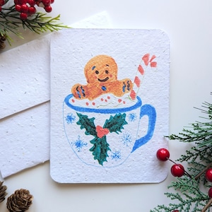 Carte de Noël, pain d'épice dans un bain à remous au chocolat chaud sur du papier à planter ou du papier blanc aquarelle, bordures usées