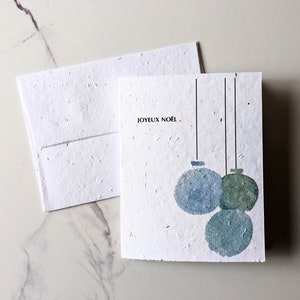 Carte de Noël, enveloppe à planter, graines de fleurs sauvages, décorations de Noël joyeux Noël sur papier de graines de fleurs sauvages blanc