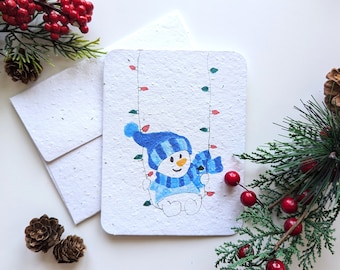Snowman on Christmas light swing on plantable paper or watercolor white paper, worn out borders