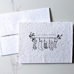 Enveloppe de carte à planter graines de fleurs sauvages, bas de Noël joyeux Noël sur papier de graines de fleurs sauvages blanc, carte de Noël