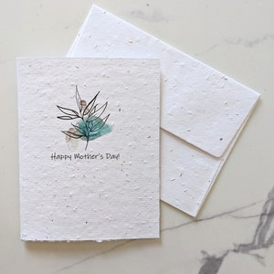 Aquarelle feuille bleue sur papier à planter ou papier blanc aquarelle, bordures usées, joyeuse fête des mères, carte des mères