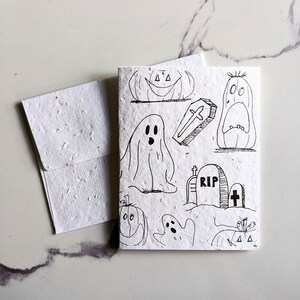 Fantômes, citrouille, cercueil, pierre tombale sur du papier pour graines ou du papier blanc aquarelle, carte d'halloween