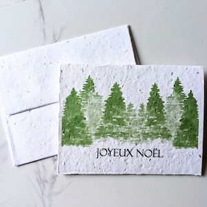 Enveloppe de carte à planter graines de fleurs sauvages, forêt de pins de Noël vert sur papier de graines de fleurs sauvages blanc, joyeux Noël, carte de Noël