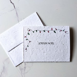 Enveloppe de carte à planter graines de fleurs sauvages, lumière de Noël joyeux Noël sur papier blanc pour graines de fleurs sauvages, papier à planter, carte de Noël