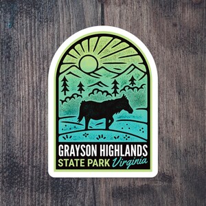 May include: A green and blue sticker with a silhouette of a horse in a mountain landscape. The sticker says "Grayson Highlands State Park Virginia".