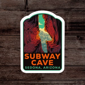 May include: A sticker featuring a stylized illustration of Subway Cave in Sedona, Arizona. The design showcases a canyon scene with red rock formations, a turquoise sky, and the text "SUBWAY CAVE" in orange, and "SEDONA, ARIZONA" in green.