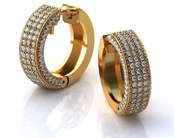 May include: A pair of gold hoop earrings with a row of small diamonds around the edge.