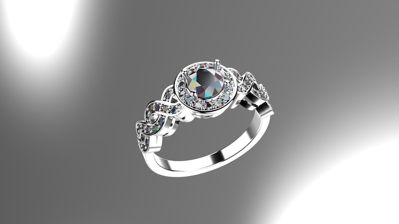 May include: A silver ring with a large, round, black gemstone surrounded by smaller white gemstones. The band of the ring is intricately designed with a braided pattern.