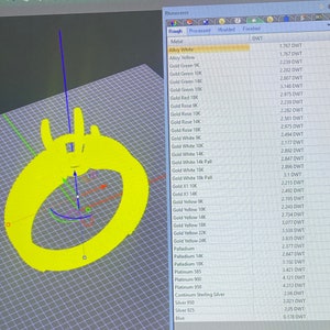 May include: A computer screen displays a 3D model of a ring in bright yellow. The ring design is visible, along with a list of metal types and their weights in DWT, including Alloy White, Gold, Palladium, and Platinum.