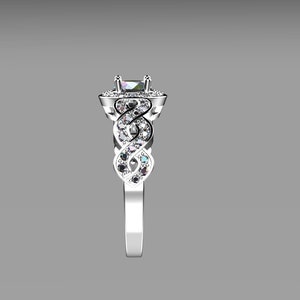 May include: A silver engagement ring with a square-shaped center stone surrounded by smaller stones. The band is intricately designed with a braided pattern and set with smaller stones.