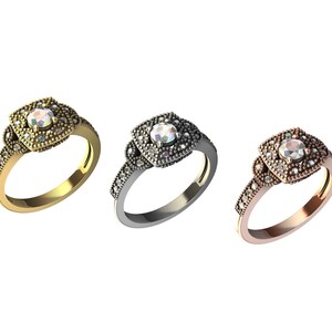 May include: Three engagement rings with a square-shaped center stone surrounded by smaller stones. The rings are in gold, silver, and rose gold.