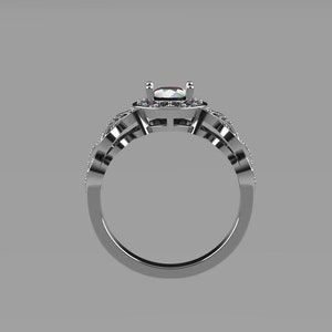 May include: A silver engagement ring with a large, clear center stone surrounded by smaller stones. The ring has a delicate, intricate design.