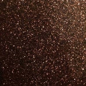 May include: A close-up of a brown glitter background. The glitter is very fine and creates a shimmering effect.
