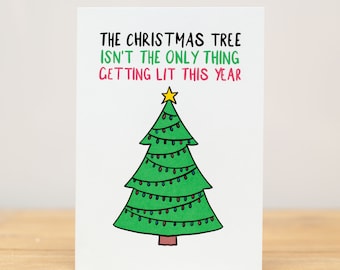 May include: A white card with a green Christmas tree with a yellow star on top and colorful lights. The text on the card reads "The Christmas tree isn't the only thing getting lit this year."