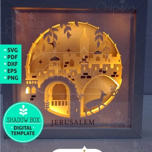 May include: A digital template for a shadow box featuring a cityscape of Jerusalem with a deer in the foreground. The template is available in SVG, PDF, DXF, EPS, and PNG formats. The text "SHADOW BOX" and "JERUSALEM" are visible in the image.