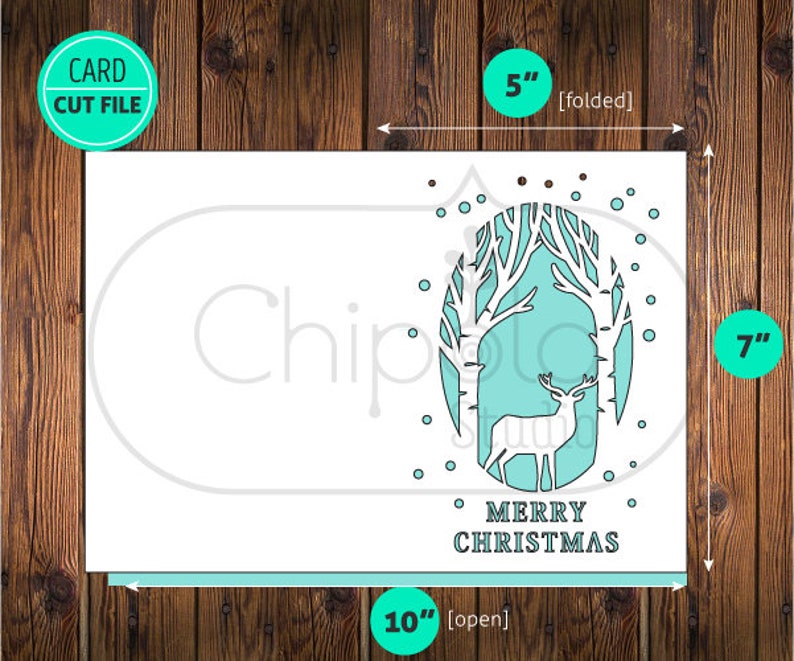 May include: A white card with a teal blue and white design of a deer in a forest. The card reads "Merry Christmas" and measures 5 inches by 7 inches when folded and 10 inches by 7 inches when open.