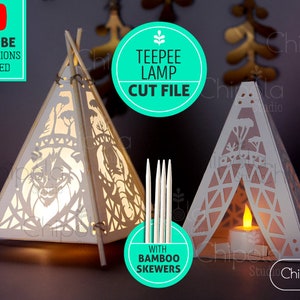 May include: A digital cut file for a teepee lamp with a woodland design. The file includes SVG, PDF, DXF, EPS, and PNG formats. The lamp is made with bamboo skewers and can be used with a tea light candle. The image shows two teepee lamps, one with a wolf design and the other with a geometric design.