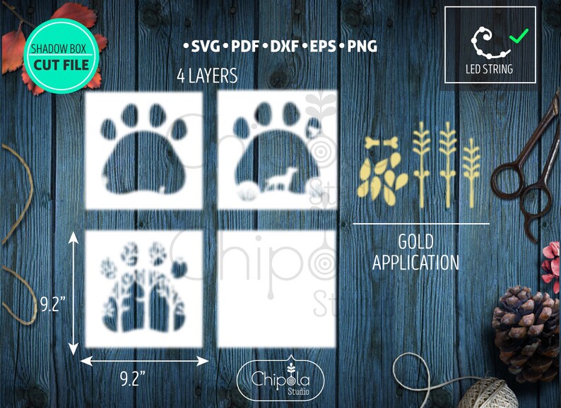 May include: Four layered shadow box cut file design featuring a paw print with a dog and trees inside. The design is 9.2 inches by 9.2 inches and includes a gold application with leaves and branches.