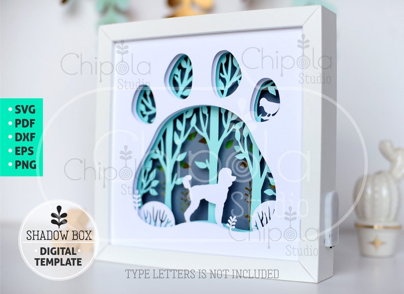 May include: A white shadow box with a paw print design. The paw print reveals a layered forest scene with a poodle silhouette. The design includes the text "SHADOW BOX DIGITAL TEMPLATE". The text "TYPE LETTERS IS NOT INCLUDED" is also visible.