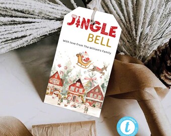 Könnte beinhalten: Ein weißer Geschenkanhänger mit roter und goldener Schrift, auf dem "Jangle Bell" und "Mit Liebe von der Familie William" steht. Der Anhänger zeigt eine Aquarell-Illustration von Santa Claus in einem Schlitten mit Rentieren, die über ein verschneites Dorf fliegen.