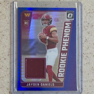 2024 Donruss Optic Jayden Daniels #RPB-JDS Rookie Phenom Blue Hyper Prizm Relic Rookie Card RC Washington Commanders