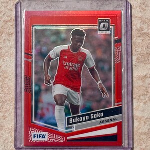 2023-2024 Panini Donruss Bukayo Saka #d/299 Rode Refractor Optic Arsenal