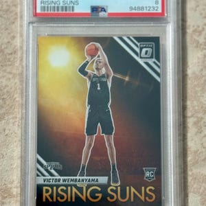2023 Panini Donruss Optic Rising Suns #11 Victor Wembanyama Rookie RC PSA 8