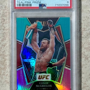 2022 Panini Select UFC Conor McGregor Teal/Pink Prizm #d/49 PSA 9 Mint