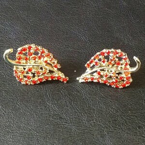 Mid-century signed Dodds Doodz red rhinestone leaf clip-on earrings