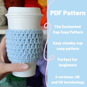 May include: A light blue, crocheted cup cosy wrapped around a white disposable coffee cup. The cosy is made with a chunky stitch pattern. Text on the right side reads "PDF Pattern", "The Enchanted Cup Cozy Pattern", and "Easy chunky cup cosy pattern".