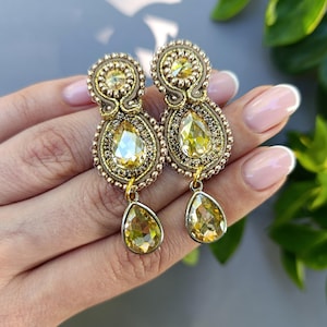 Gold color earrings.