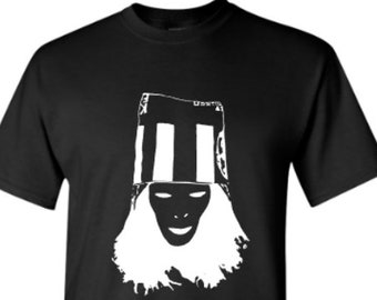 May include: Black t-shirt with a white silhouette of a person wearing a striped hat and a mask.