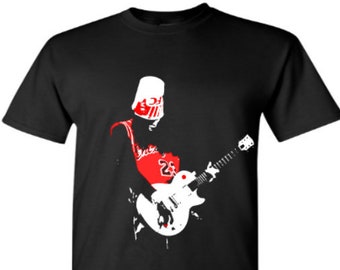 May include: Black t-shirt with a white silhouette of a person wearing a red basketball jersey and playing a white electric guitar.