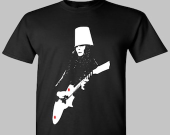 May include: Black t-shirt with a white silhouette of a person wearing a bucket hat and playing a guitar.