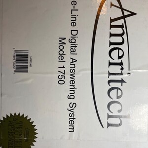 May include: A white box with black text that reads "Ameritech One-Line Digital Answering System Model 1750". A gold star sticker with the text "Tested & Approved" is in the lower left corner.