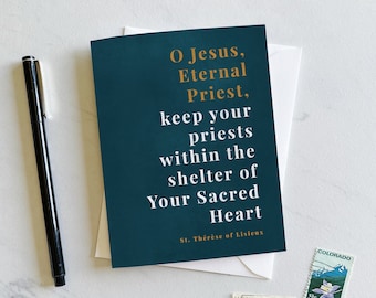 May include: A teal blue card with gold lettering that reads "O Jesus, Eternal Priest, keep your priests within the shelter of Your Sacred Heart. St. Thérèse of Lisieux."