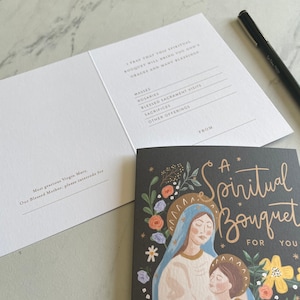 May include: A black and white card with a floral design and the text "A Spiritual Bouquet For You". The card features an illustration of the Virgin Mary holding a child. The back of the card has a space to write a message and a list of spiritual offerings.