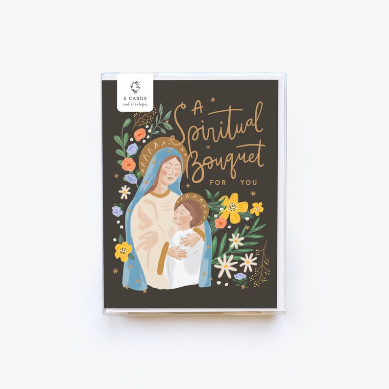 May include: A greeting card with a dark background featuring a colorful illustration of Mary and Jesus surrounded by flowers. The text on the card reads "A Spiritual Bouquet For You".