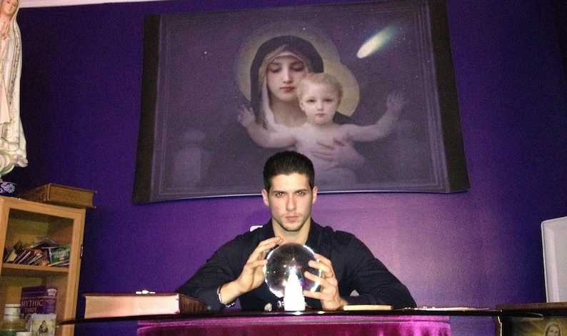 In-depth tarot card reading session led by Psychic Derek with raw quartz crystals, flickering candles, and sacred spiritual tools set on a dark altar cloth.